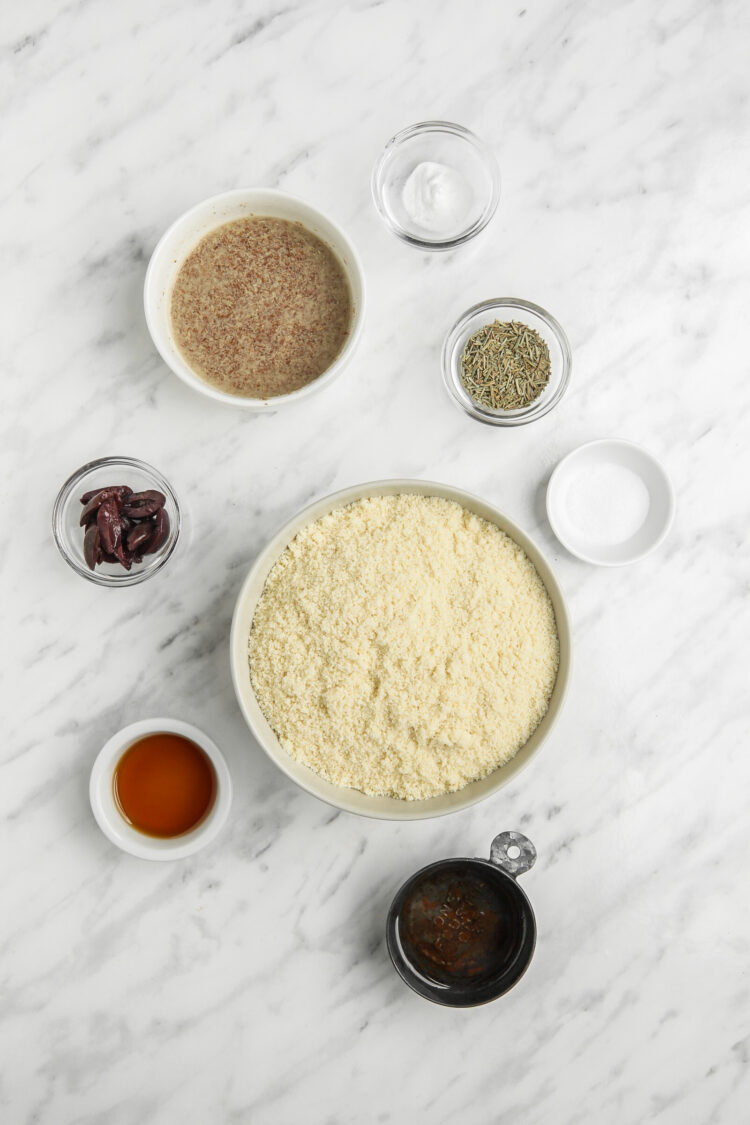 Ingredients for Low Carb Almond Flour Biscuits with Olives Almond flour, Kalamata olives, salt, baking soda, rosemary, coconut oil, flax eggs, agave.