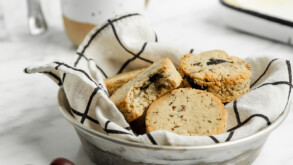 Grain Free & Vegan Almond Flour Biscuits in a serving bowl with a coffee on the side