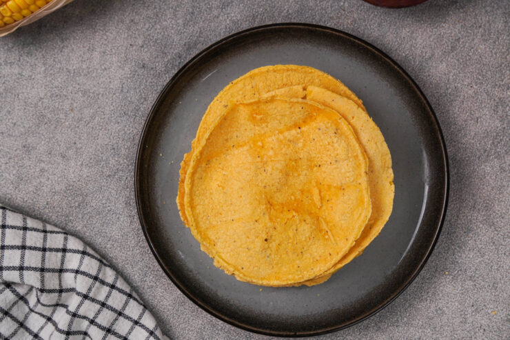 A plate of golden-brown masa harina tortillas.