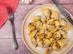 Plated canned artichoke hearts recipe with garlic, olive oil and lemon juice.
