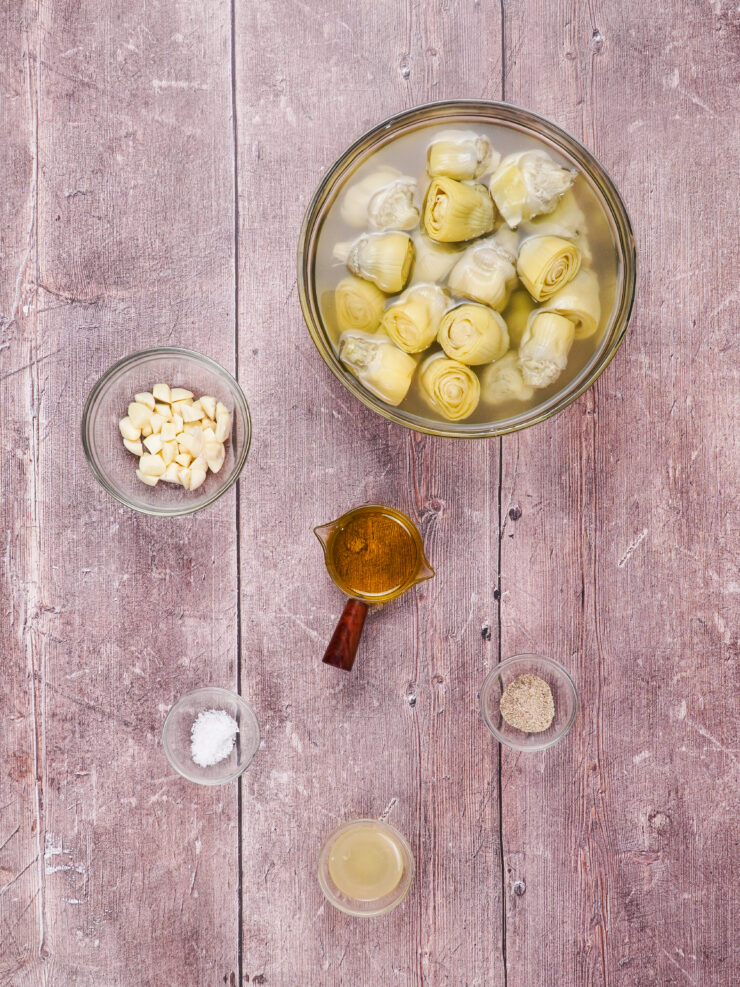 Baked artichoke hearts recipe including canned artichokes, olive oil and garlic.