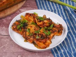 Plated dumpling bake recipe in red curry soup.